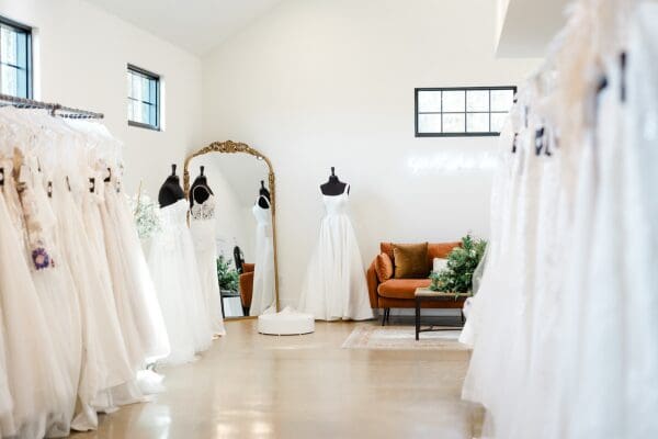 A room full of wedding gowns in different silhouettes