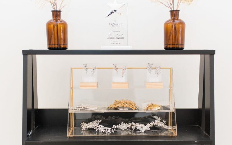Bridal accessories display with earrings, hairpieces, and jewelry in a boutique setting