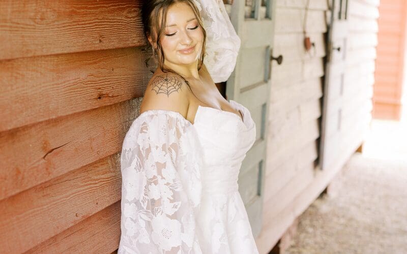 Bride wearing a lace long-sleeve wedding dress with a full skirt