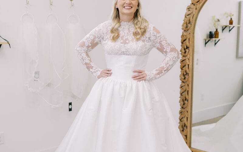 Bride wearing a white wedding dress while shopping at a bridal boutique